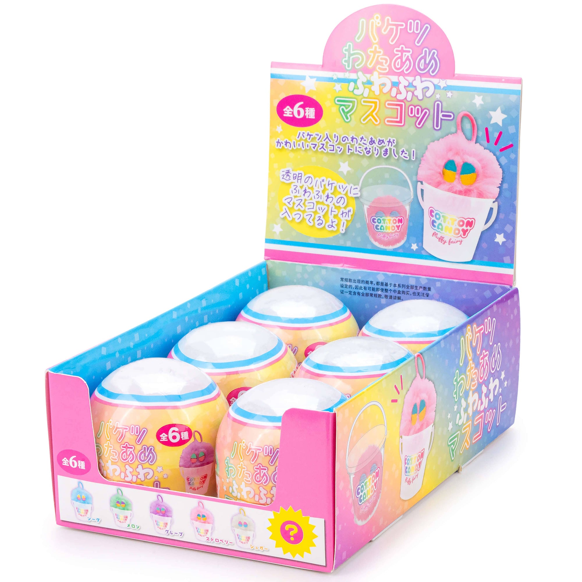Display box of colorful capsules with Japanese text on a white background