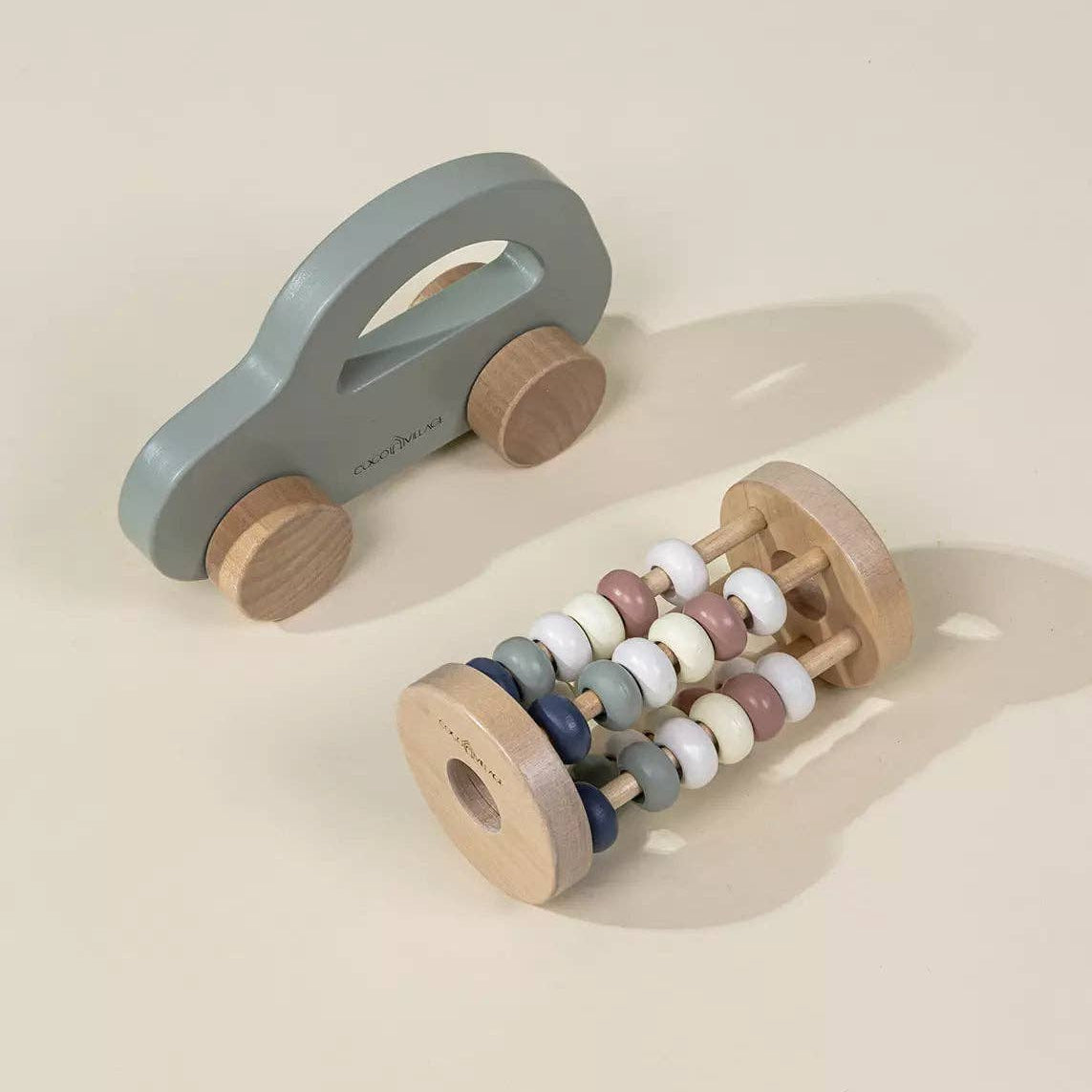 Wooden toy car and abacus on a beige background