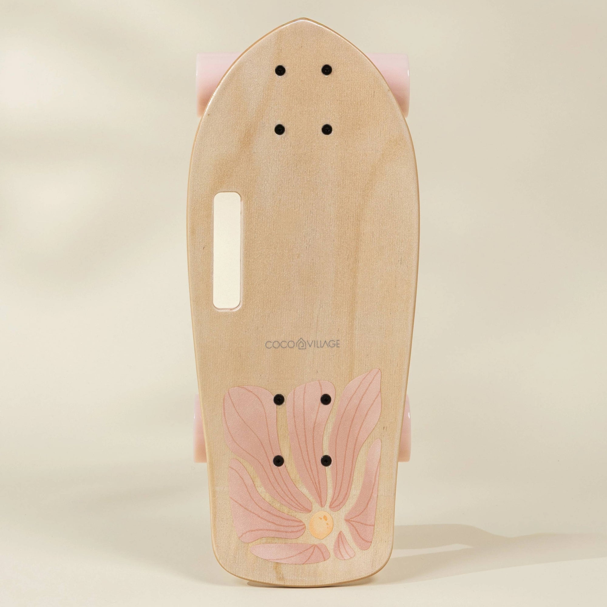 Wooden skateboard deck with floral design on a beige background