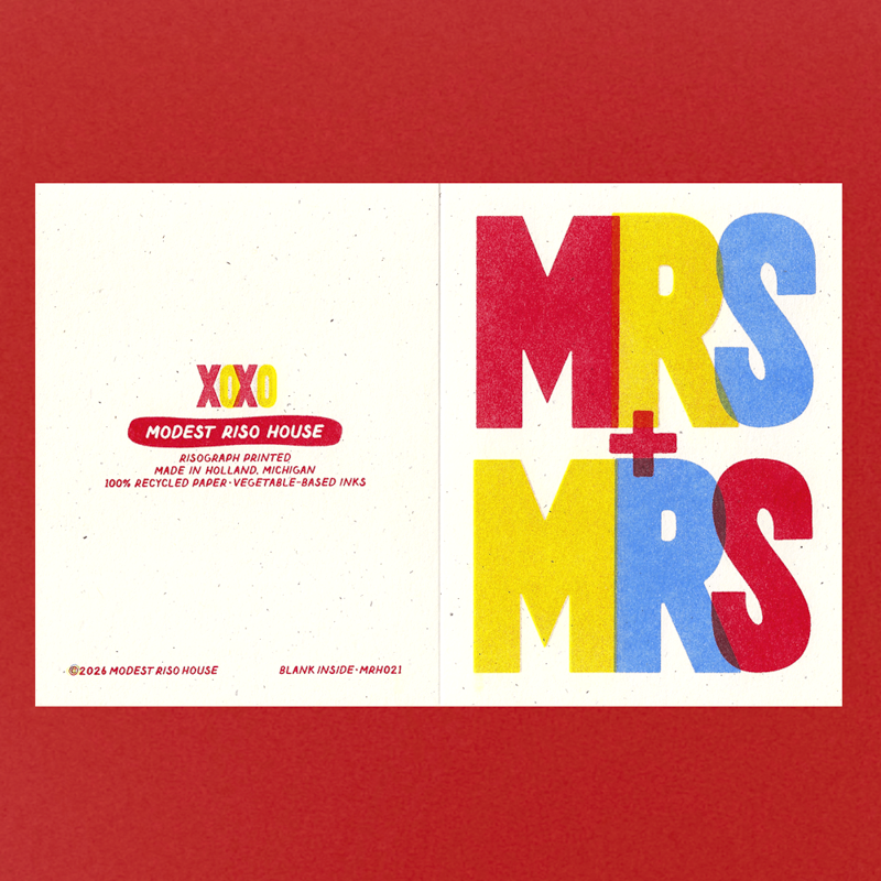 A square art print or card design shown against a solid red background. The print itself is split into two halves: the left side is off-white with small red and yellow text reading 'XOXO MODEST RISO HOUSE' and 'DIGIPHARM RIMED'; the right side is also off-white with large stacked letters 'MRS' in red, yellow, and blue, plus a blue plus sign between them.