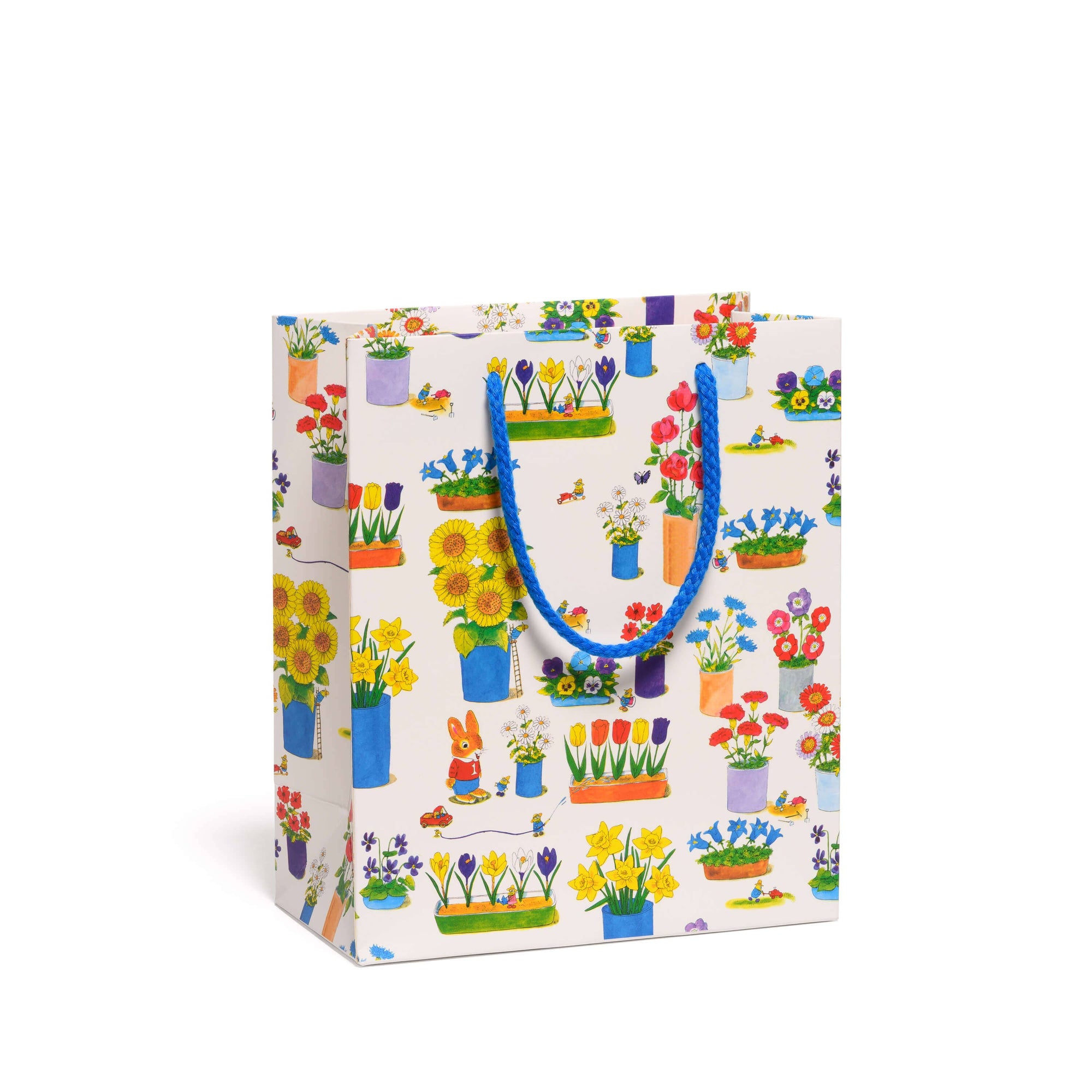 Gift bag with floral design and blue handle on a white background