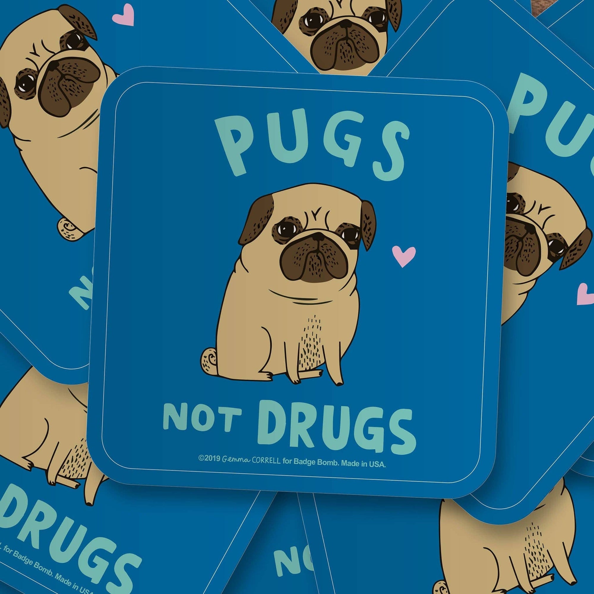 Coaster with pug illustration and 'Pugs Not Drugs' text on a blue background