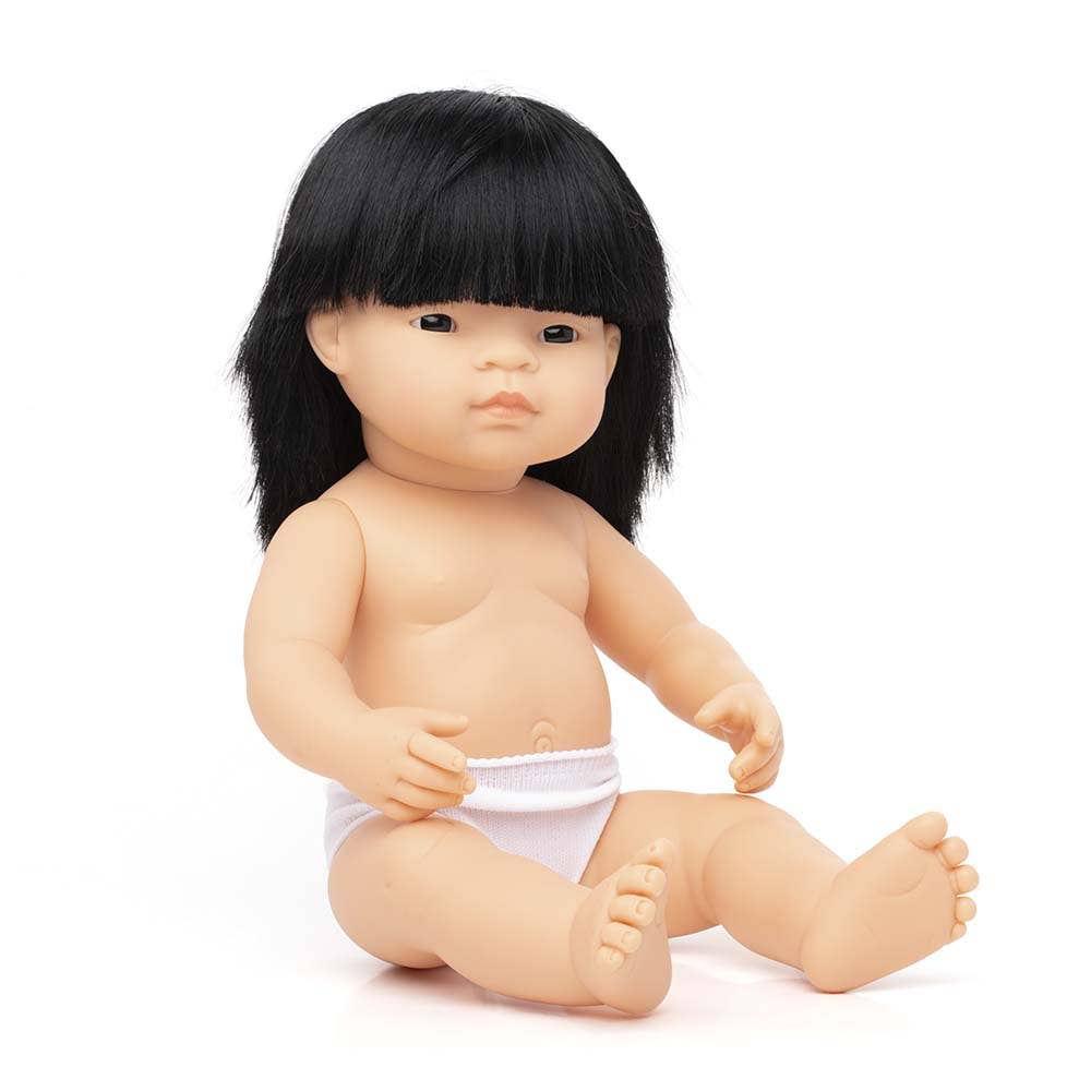 Baby doll with black hair and a diaper on a white background