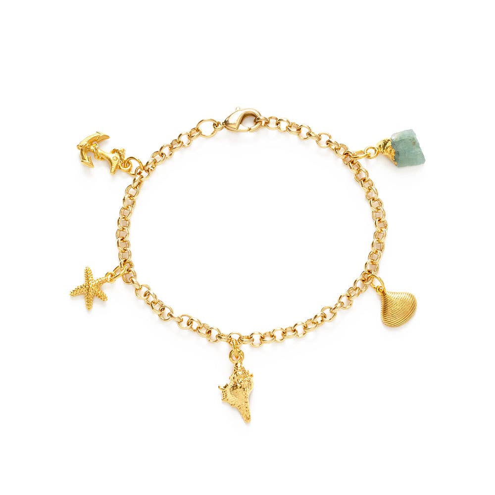 Gold bracelet with various charms on a white background