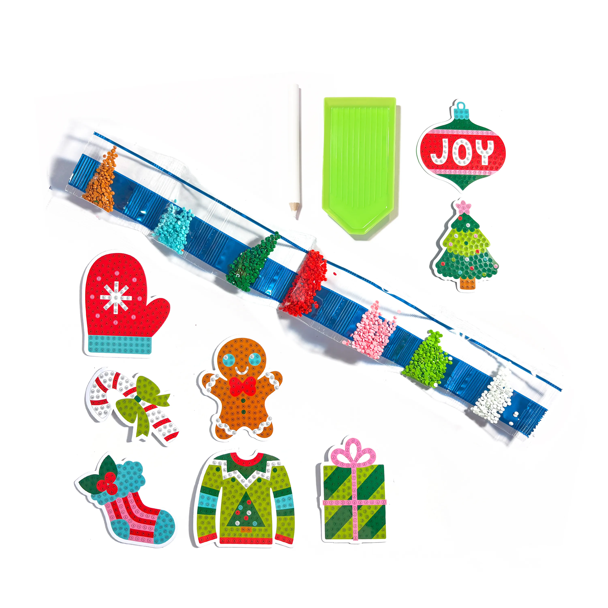 Set of Christmas-themed decorative items including a string with beads, a 'JOY' ornament, and various festive figures on a white background.