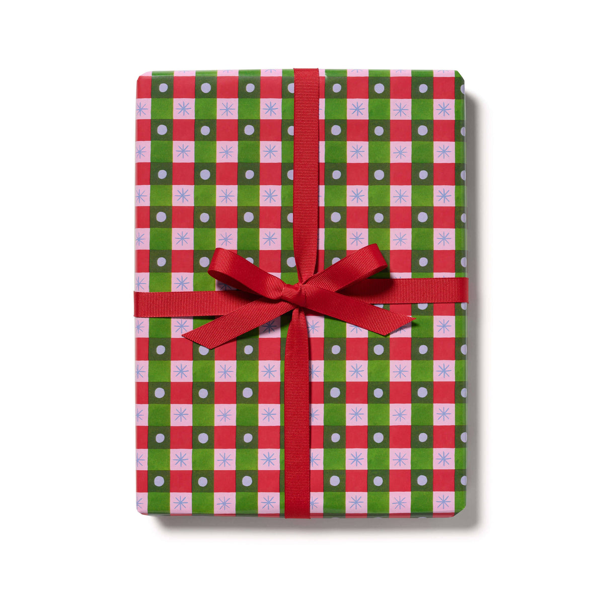 A rectangular gift box wrapped in festive holiday paper with a red and green plaid pattern, white snowflake motifs, and a red ribbon tied in a bow, shown on a white background.