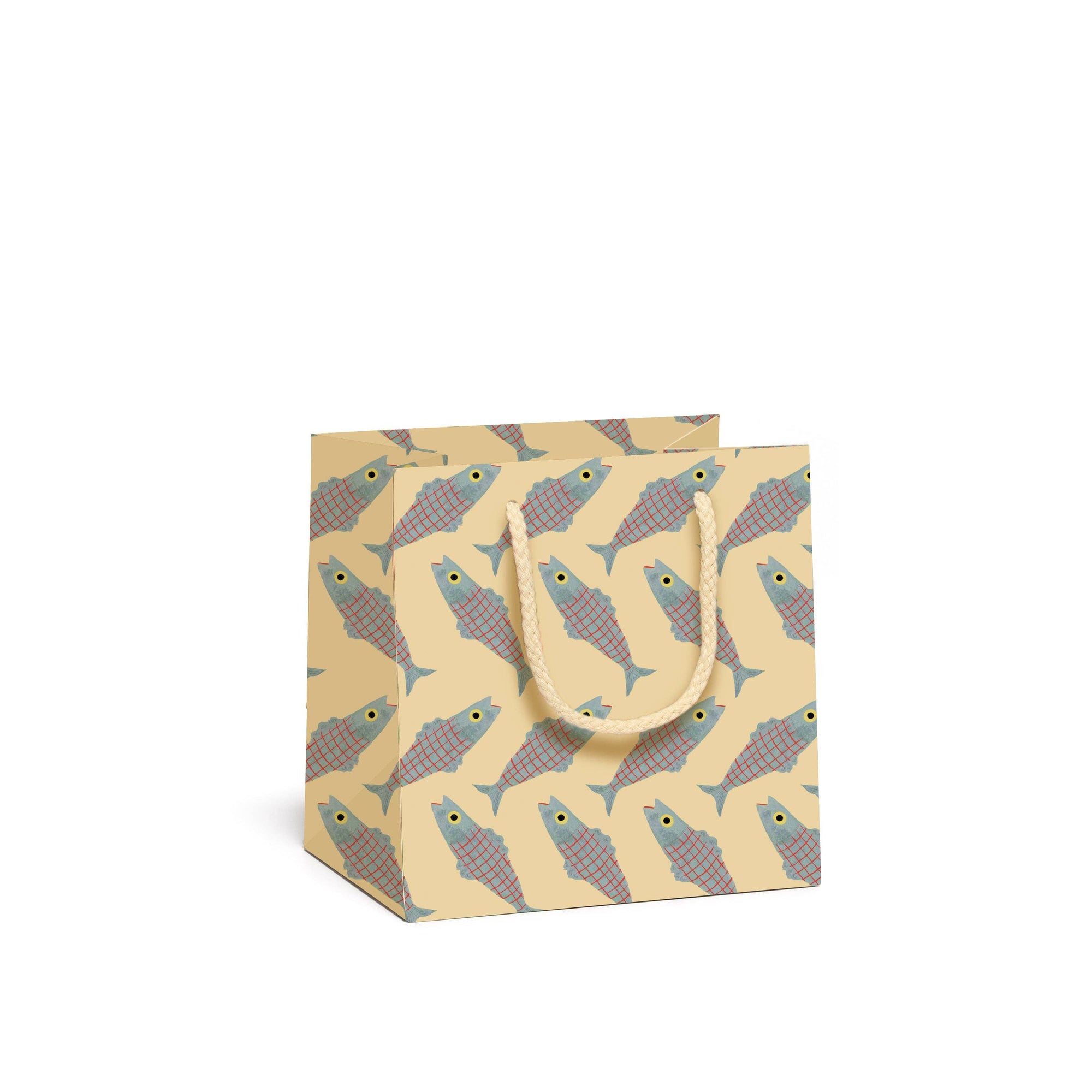 Small gift bag with fish pattern on a beige background