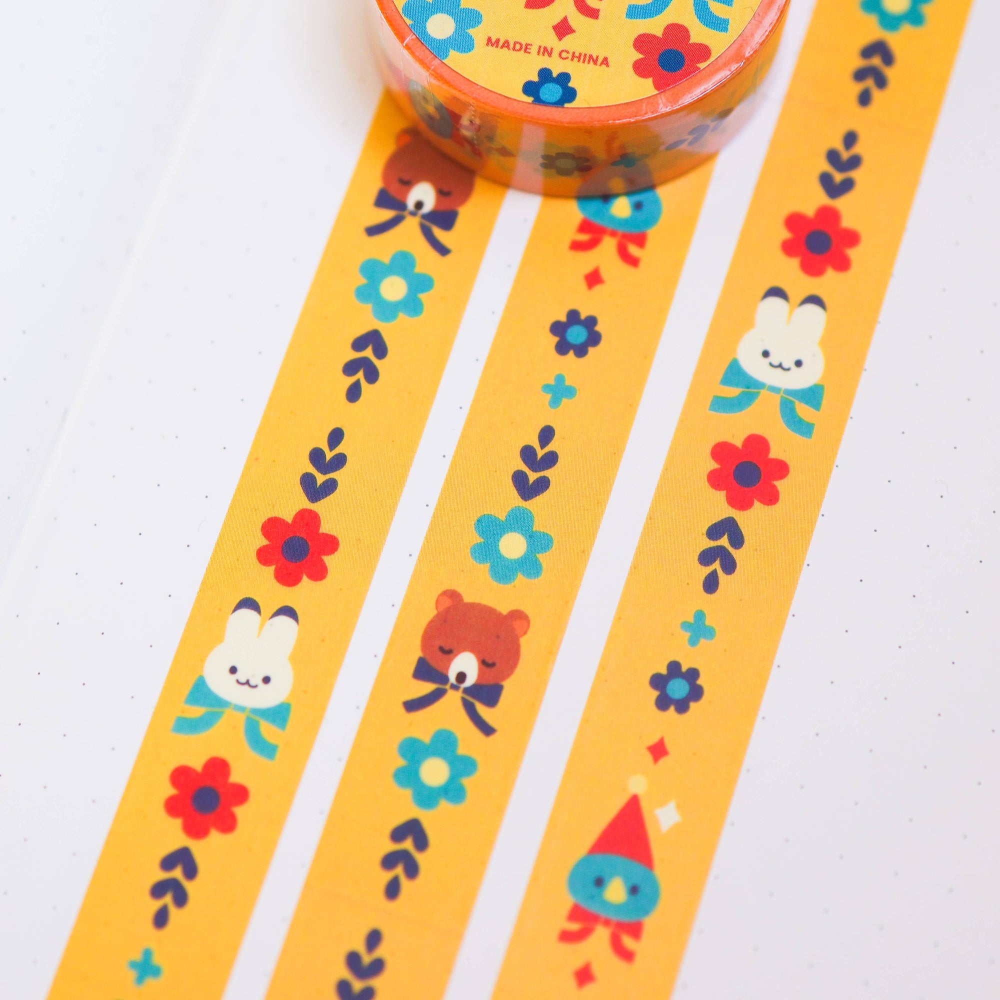 Decorative tape with cartoon characters and flowers on a white background