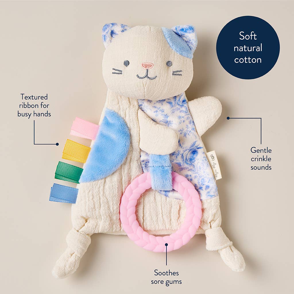 Baby toy with crinkle sound feature and textured ribbon on a beige background