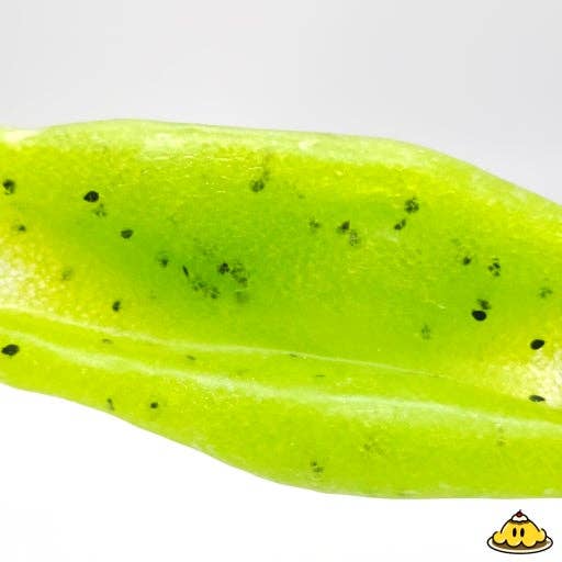 A close-up of a bright lime green silicone fishing lure skirt with small black glitter flecks, shown against a plain white background.