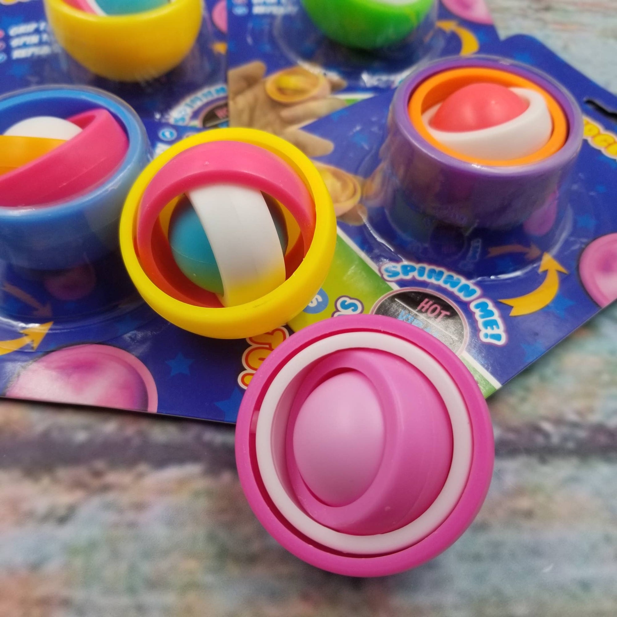 Colorful spinning tops on a colorful packaging background