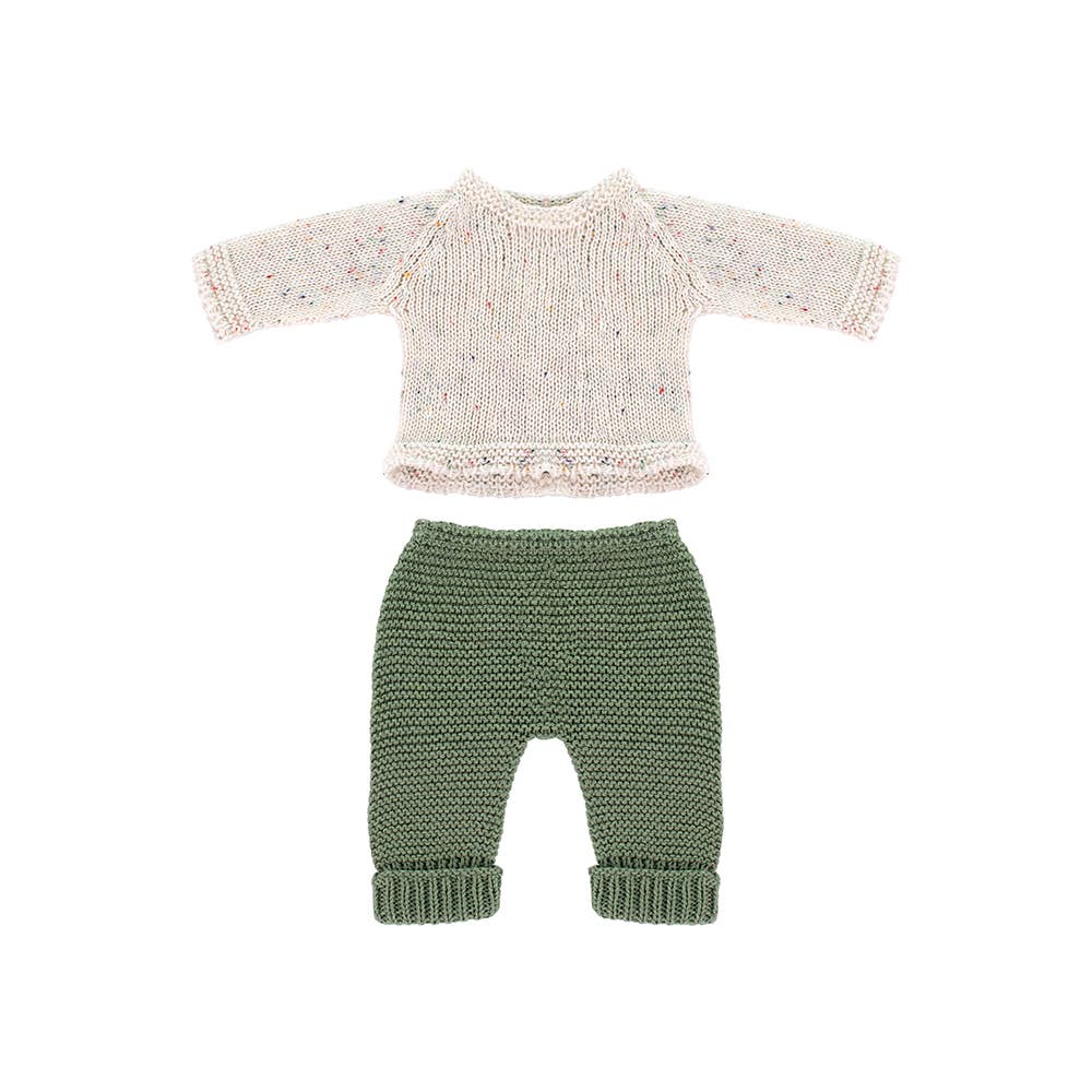 Knitted doll's sweater and pants set on a white background