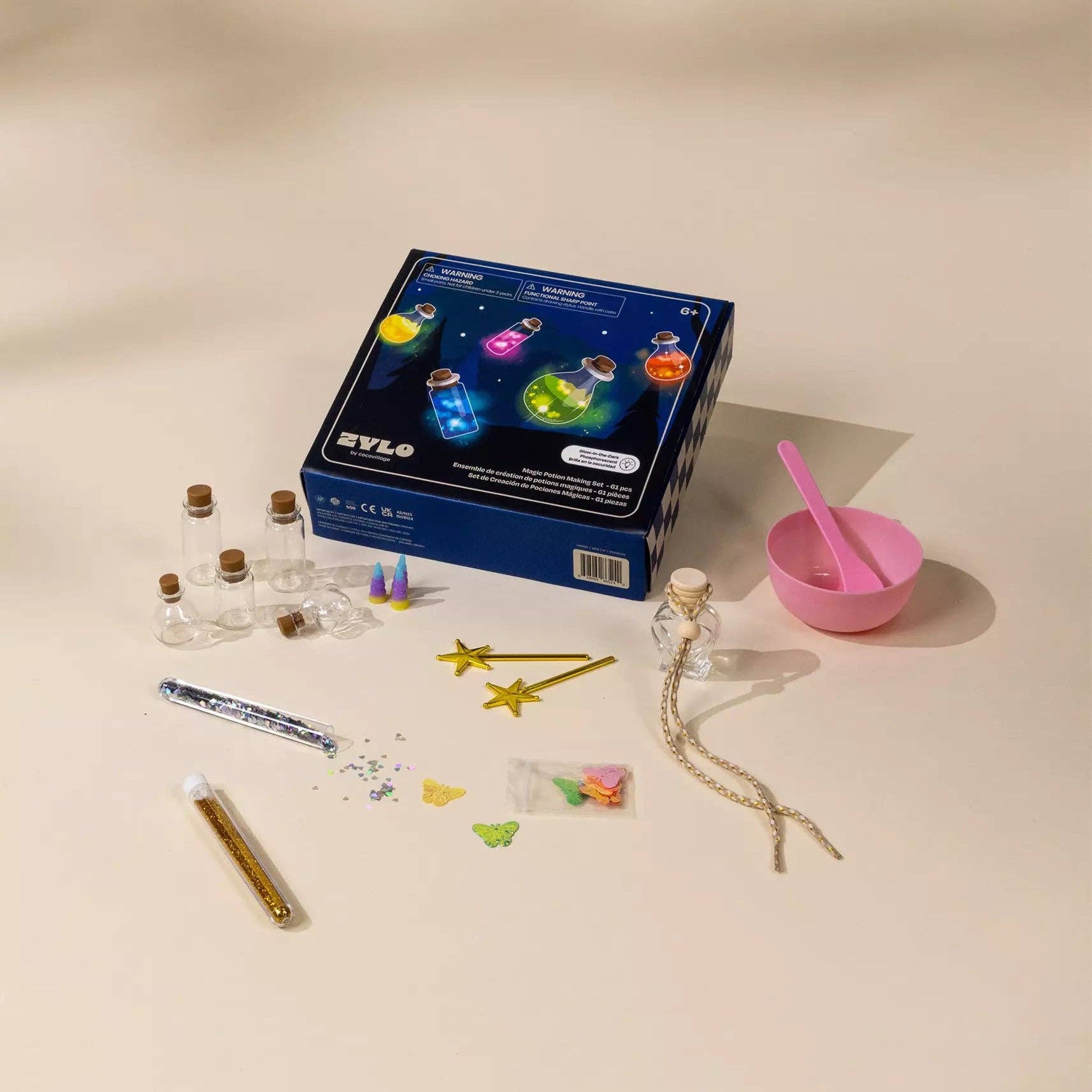 Science experiment kit with components on a beige background