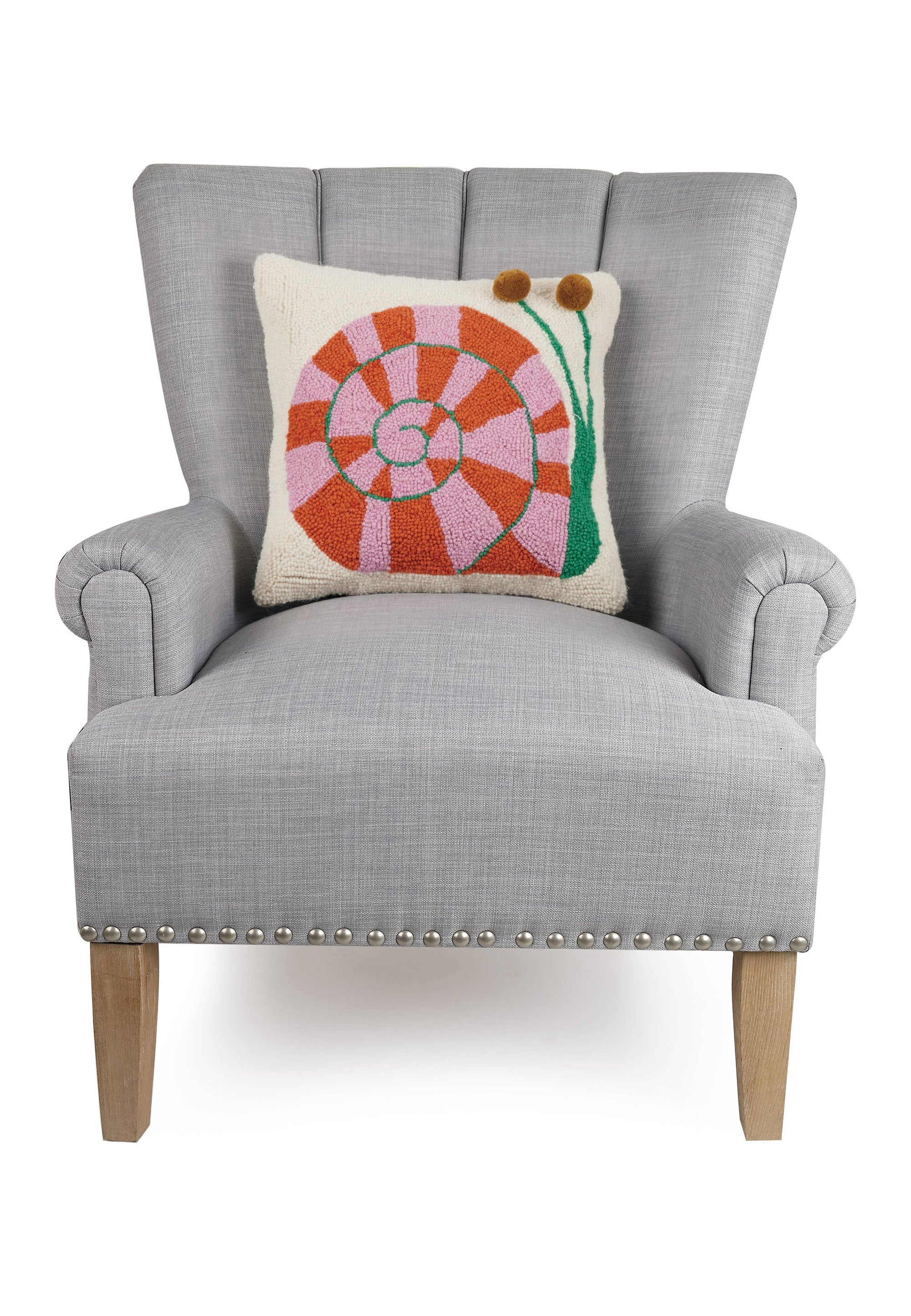Gray armchair with a colorful pillow on a white background