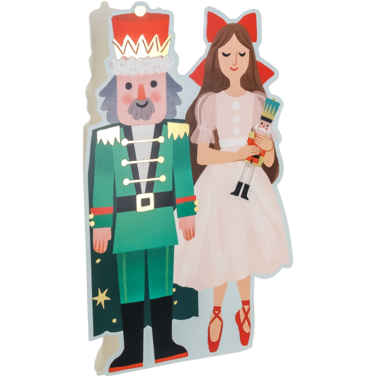 Cardboard cutouts of a Nutcracker and a Princess on a white background