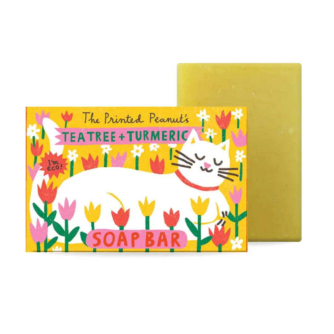Soap bar with a colorful label featuring a cat and flowers on a white background
