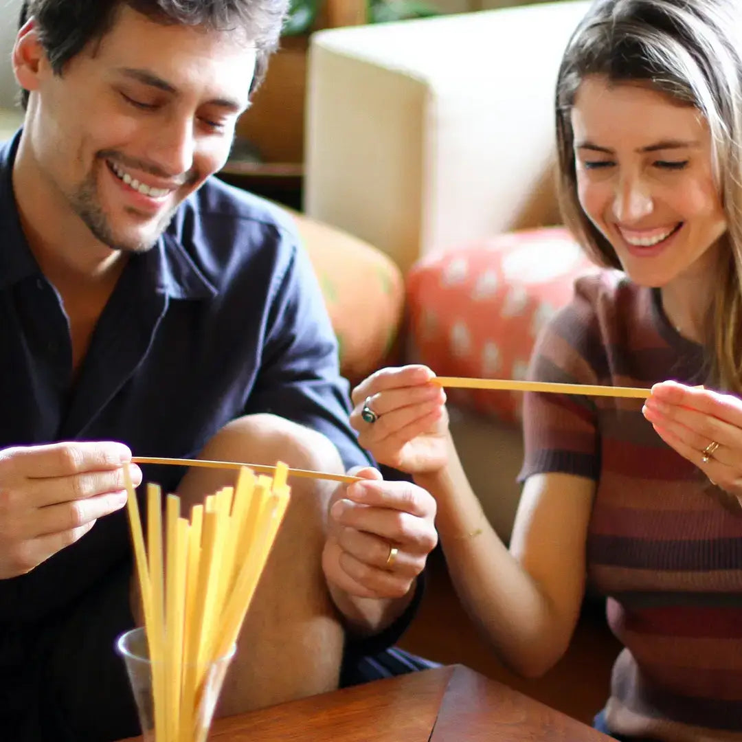 Two people playing with game strips in a casual indoor setting