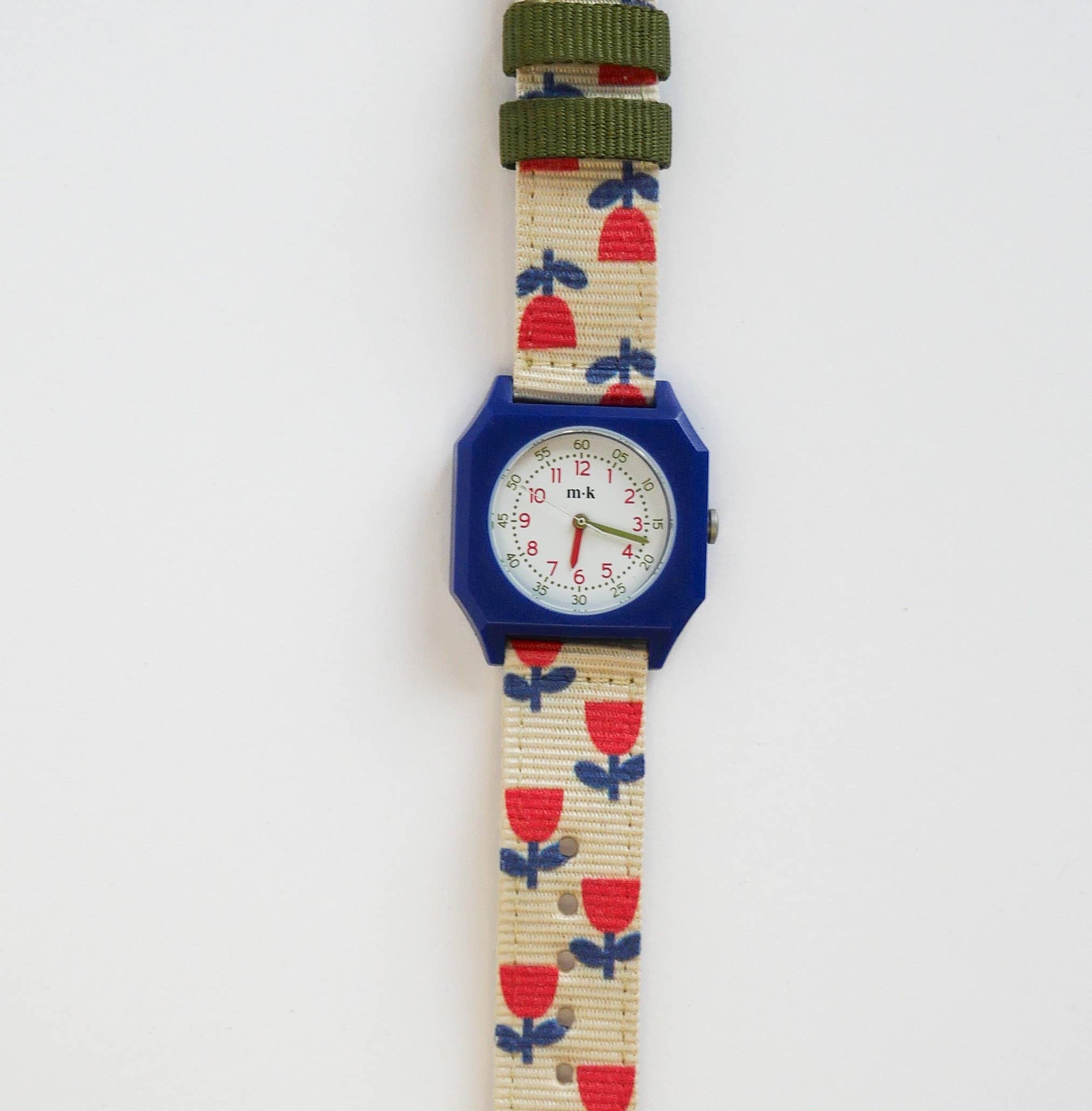 Children's watch with a floral strap on a white background
