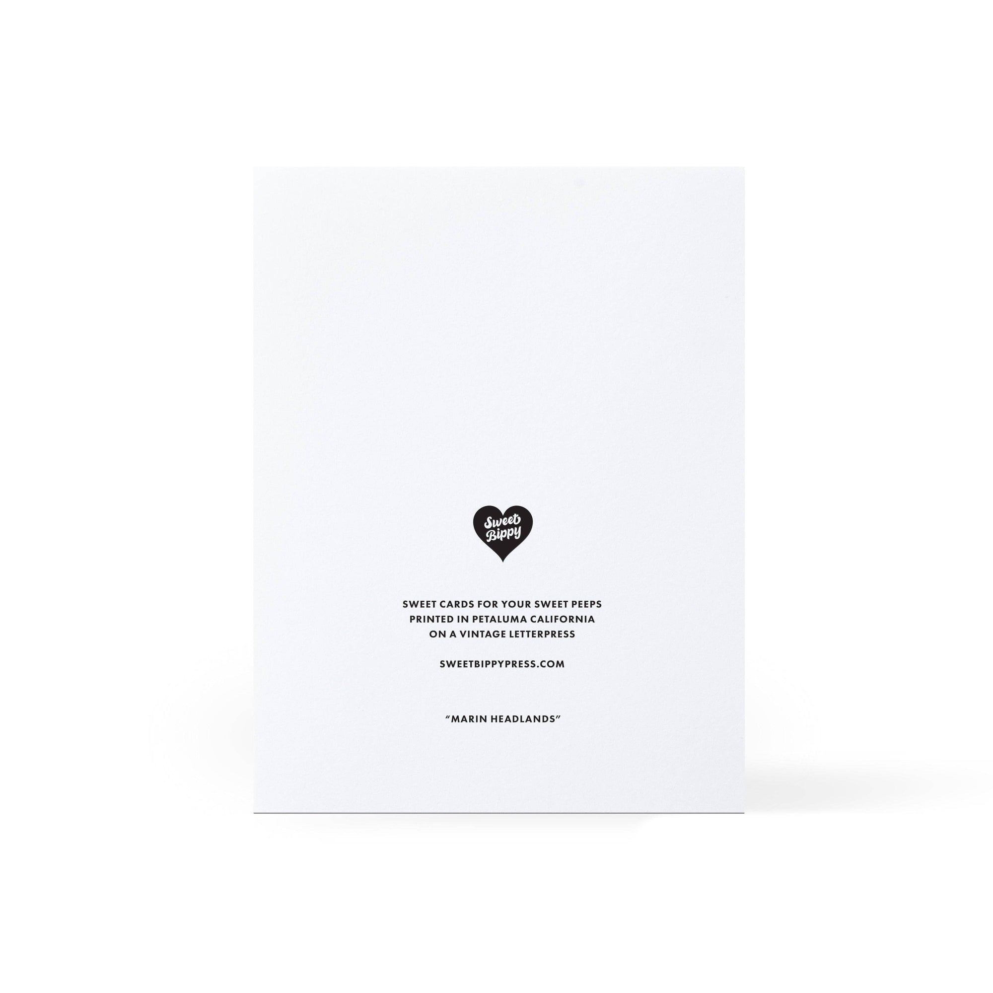 Back of a white card with black text and a heart-shaped logo on a white background