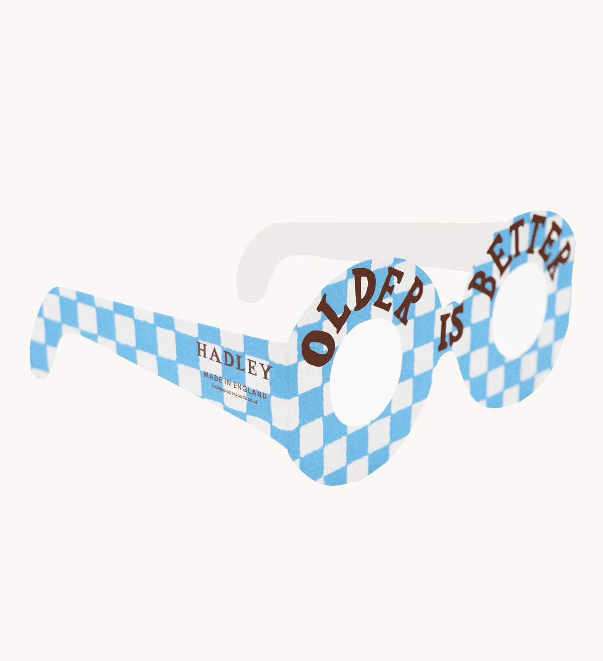 Novelty sunglasses with blue and white checkered frame and 'Older is Better' text on a white background