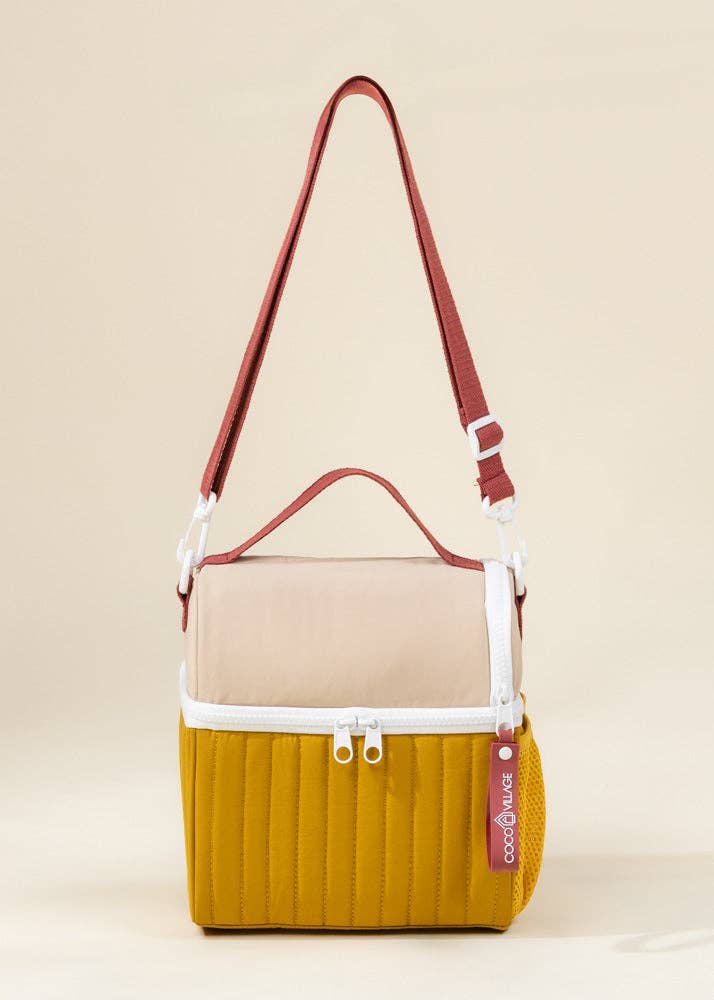 Multicolored bag with a strap on a beige background