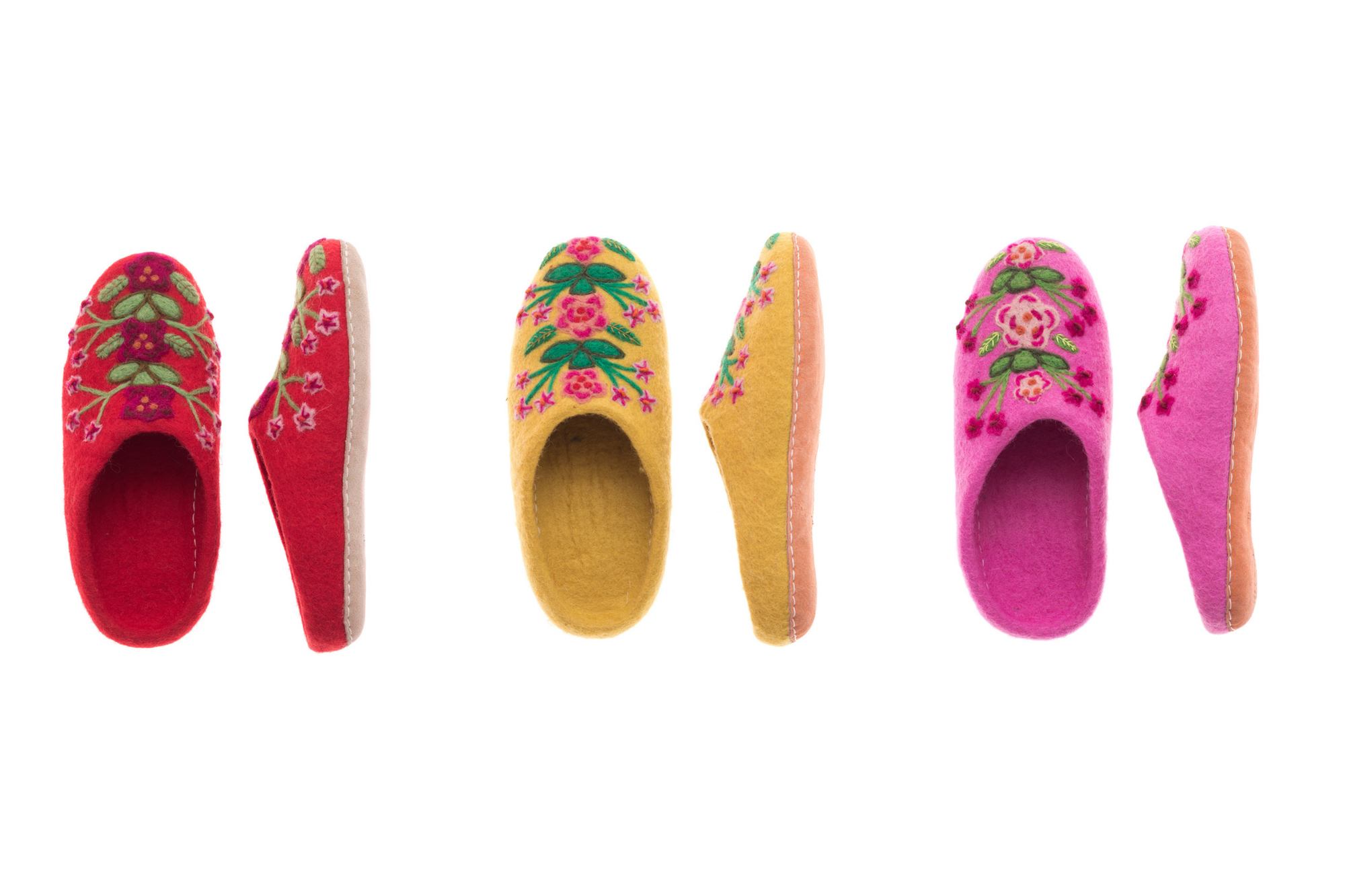 Set of colorful slippers with floral designs on a white background