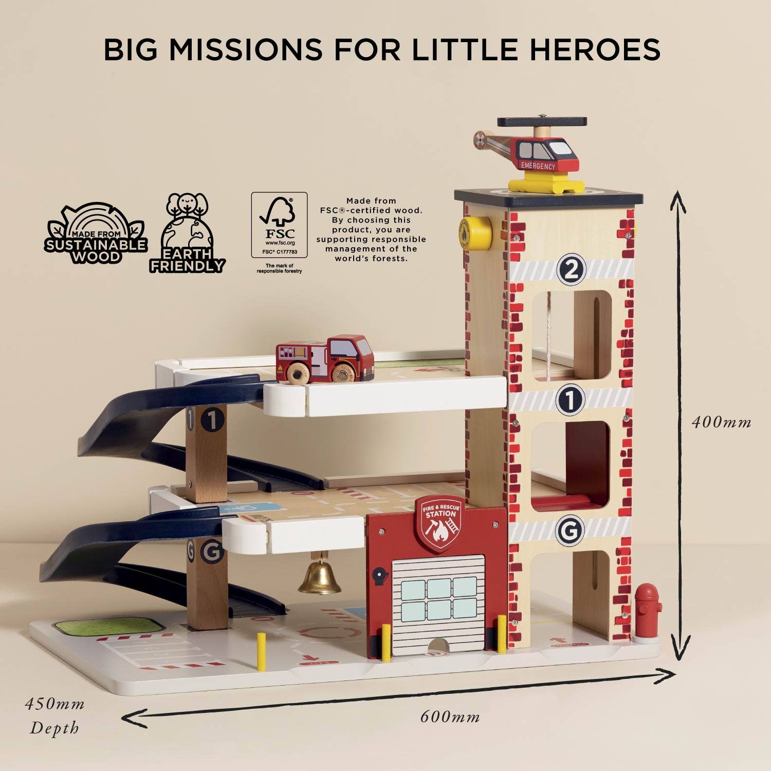 Wooden toy fire station with various compartments and a helicopter, labeled 'Big Missions for Little Heroes'.