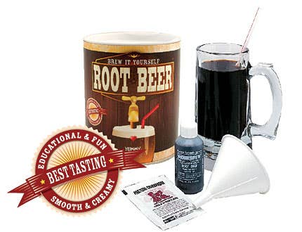 Root beer making kit with mug, label, funnel, and packets on a white background