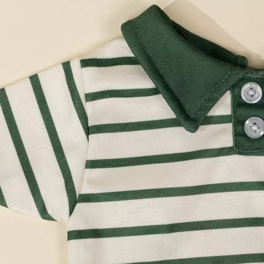 Green and white striped polo shirt with buttons on a beige background