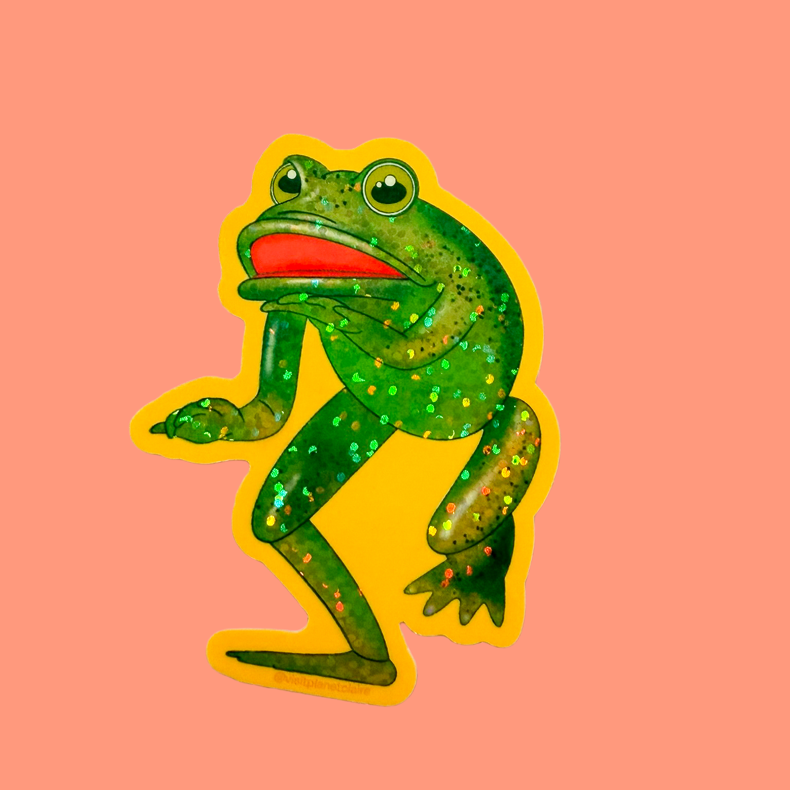 Illustration of a green frog with a red tongue on a pink background