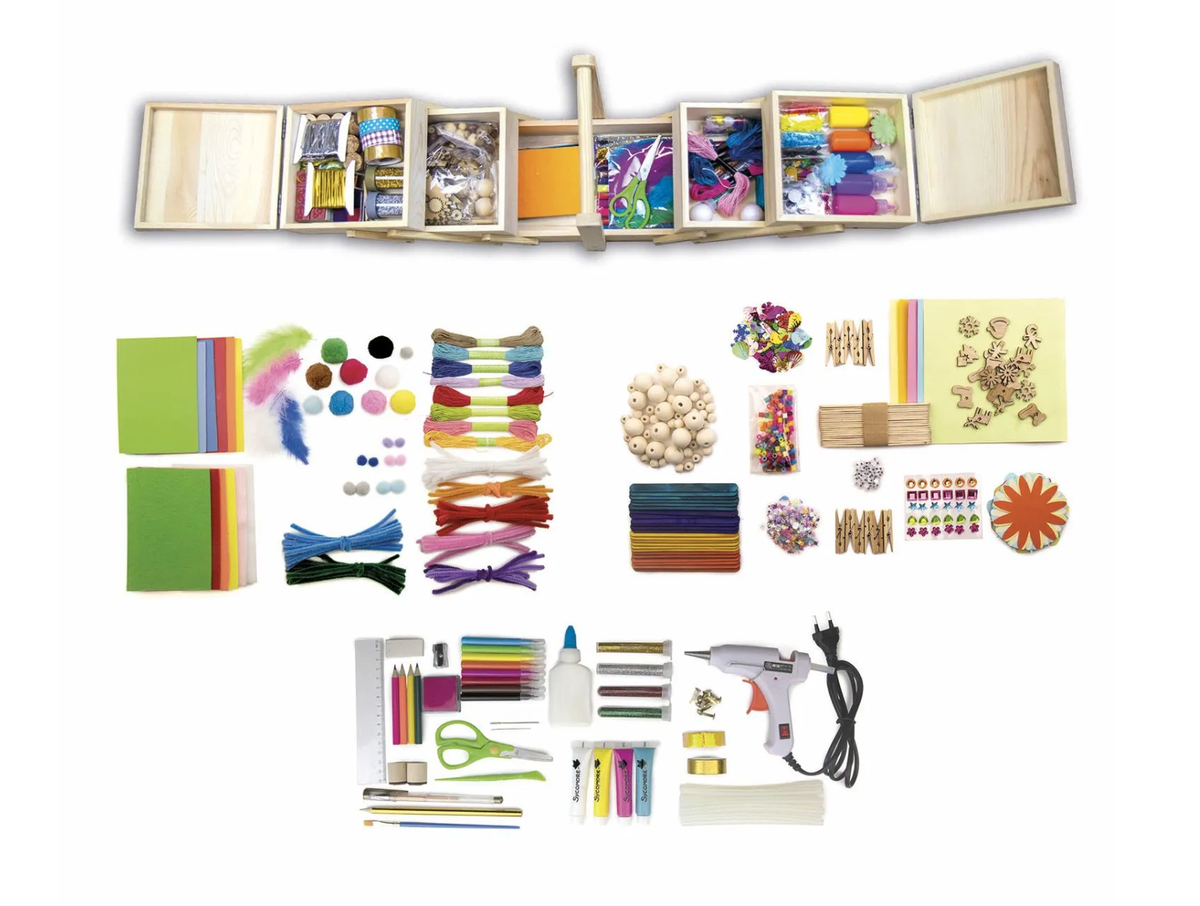 A comprehensive craft kit displayed on a clean white background, featuring a large wooden storage box filled with colorful supplies at the top, and various individual craft materials neatly arranged below, including ribbons, feathers, beads, stickers, colored pencils, a hot glue gun, and other tools.