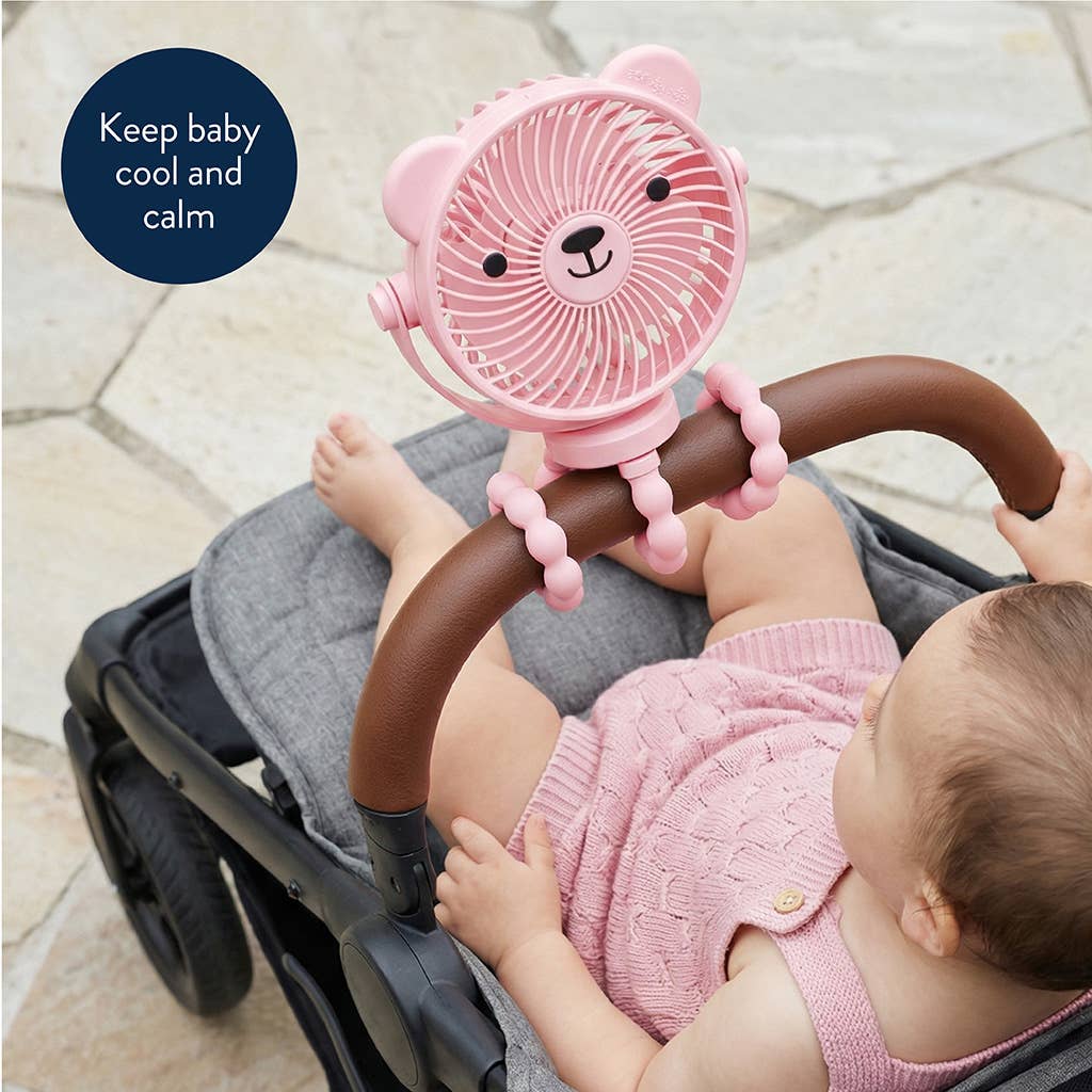 Baby in a stroller with a pink bear-shaped fan attached to the handle.