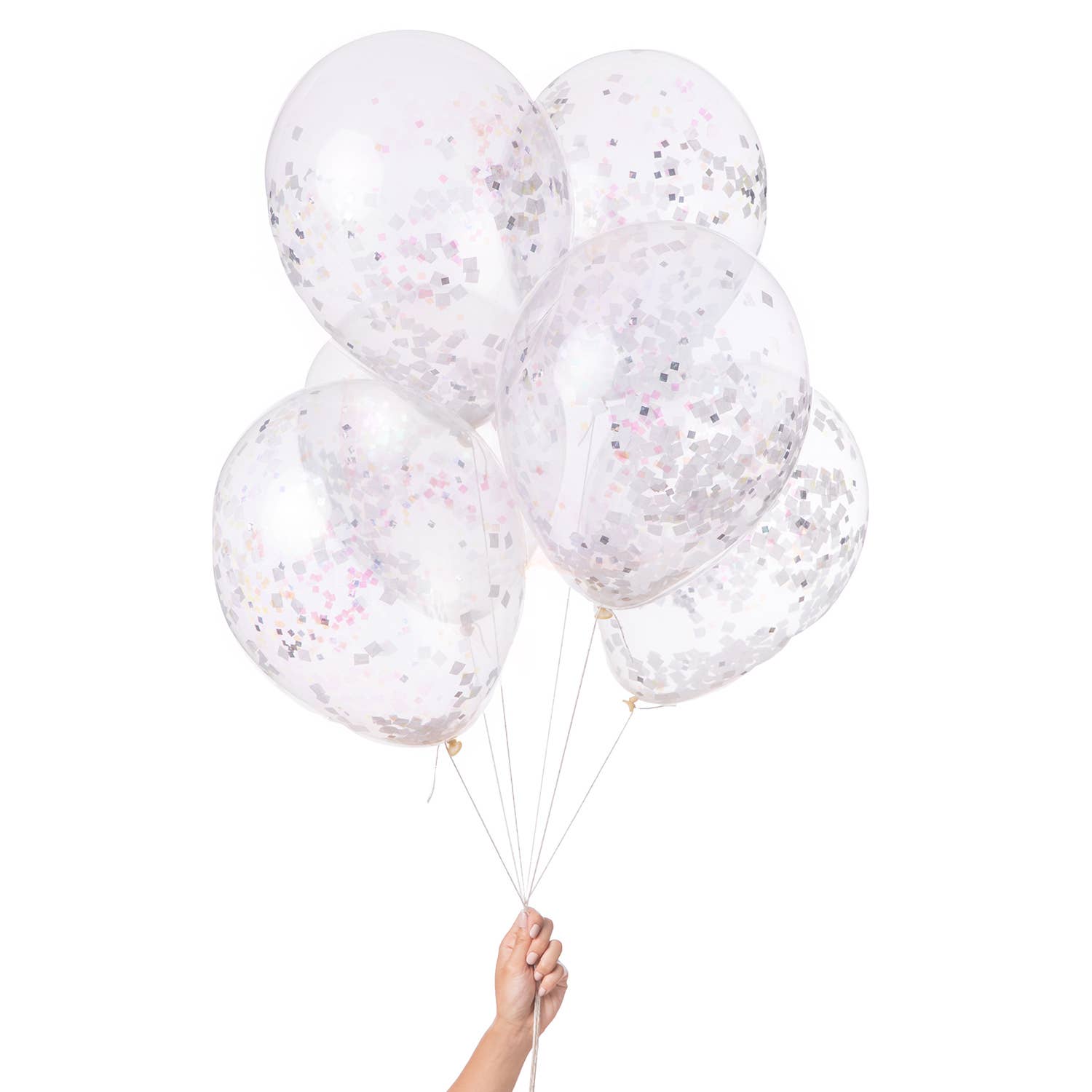 Clear balloons with confetti held by a hand on a white background