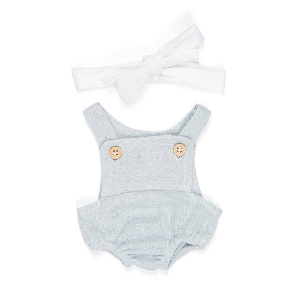 Light blue doll romper with button details and a matching headband on a white background