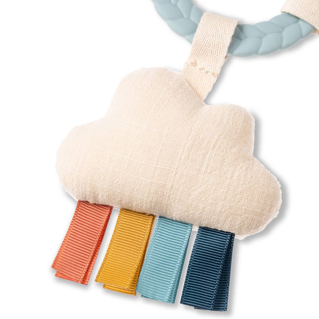 Cloud-shaped teething toy with colorful tabs on a white background