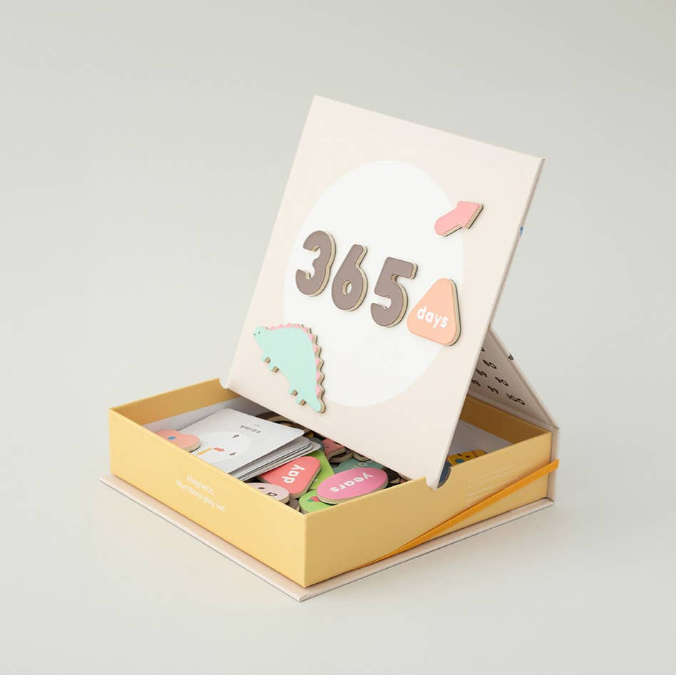 Box of tea bags with a card labeled '365' on a light gray background