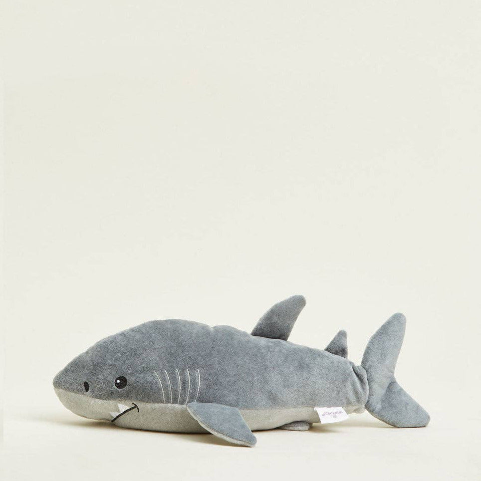 Gray shark plush toy on a white background
