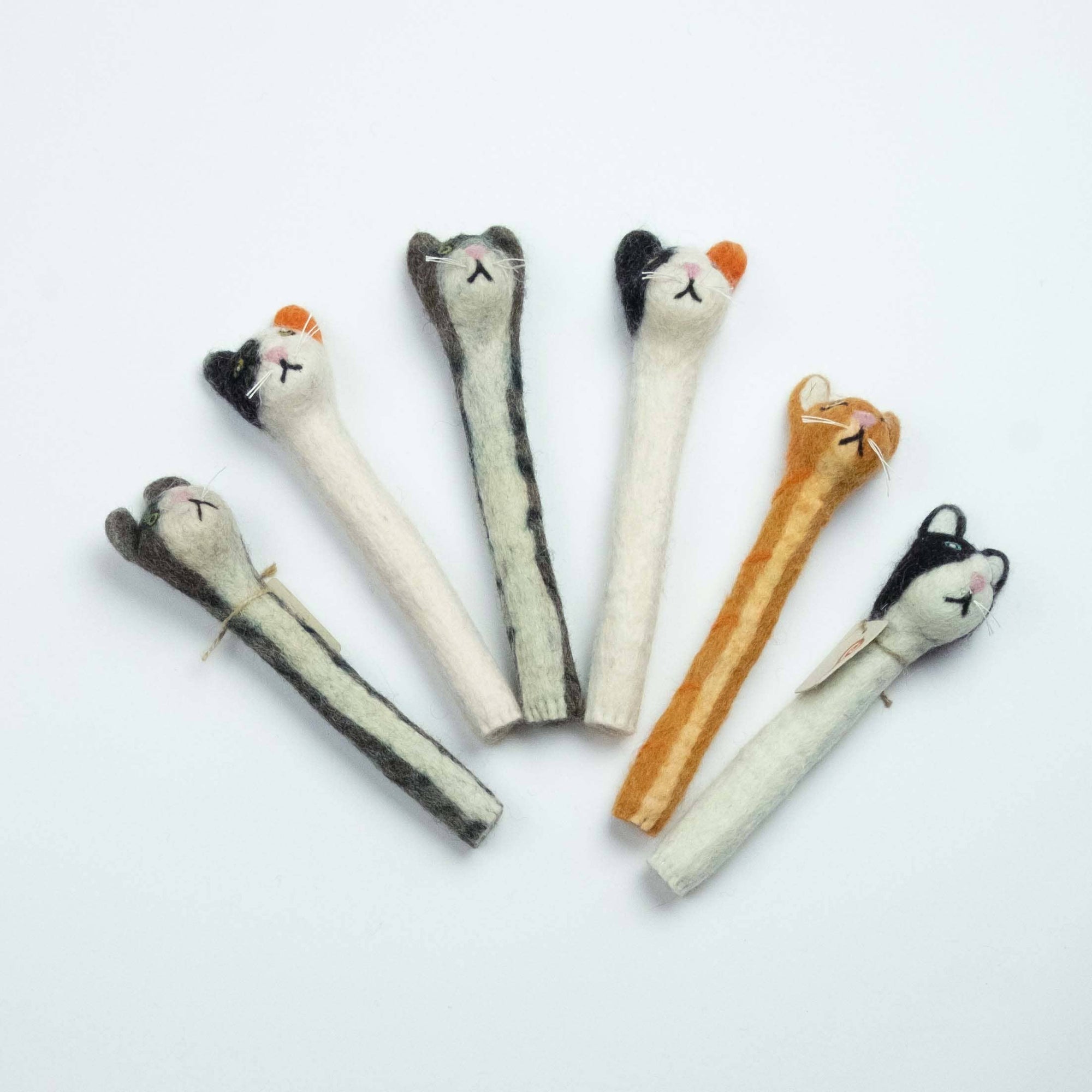 Set of five catnip toys shaped like birds on a white background