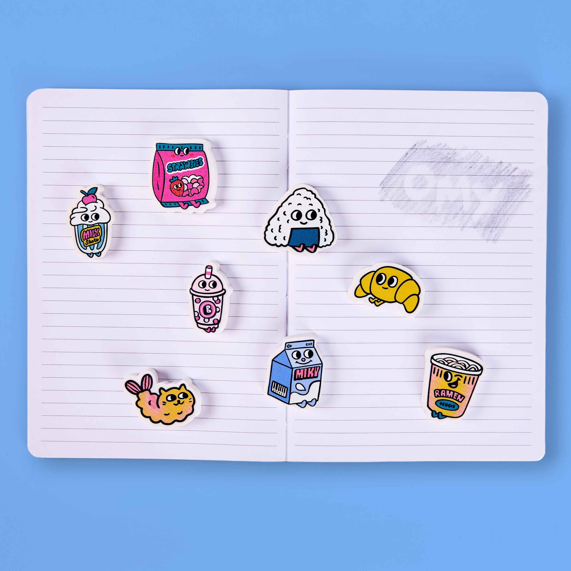 Colorful cartoon-style pins on a notebook with a blue background
