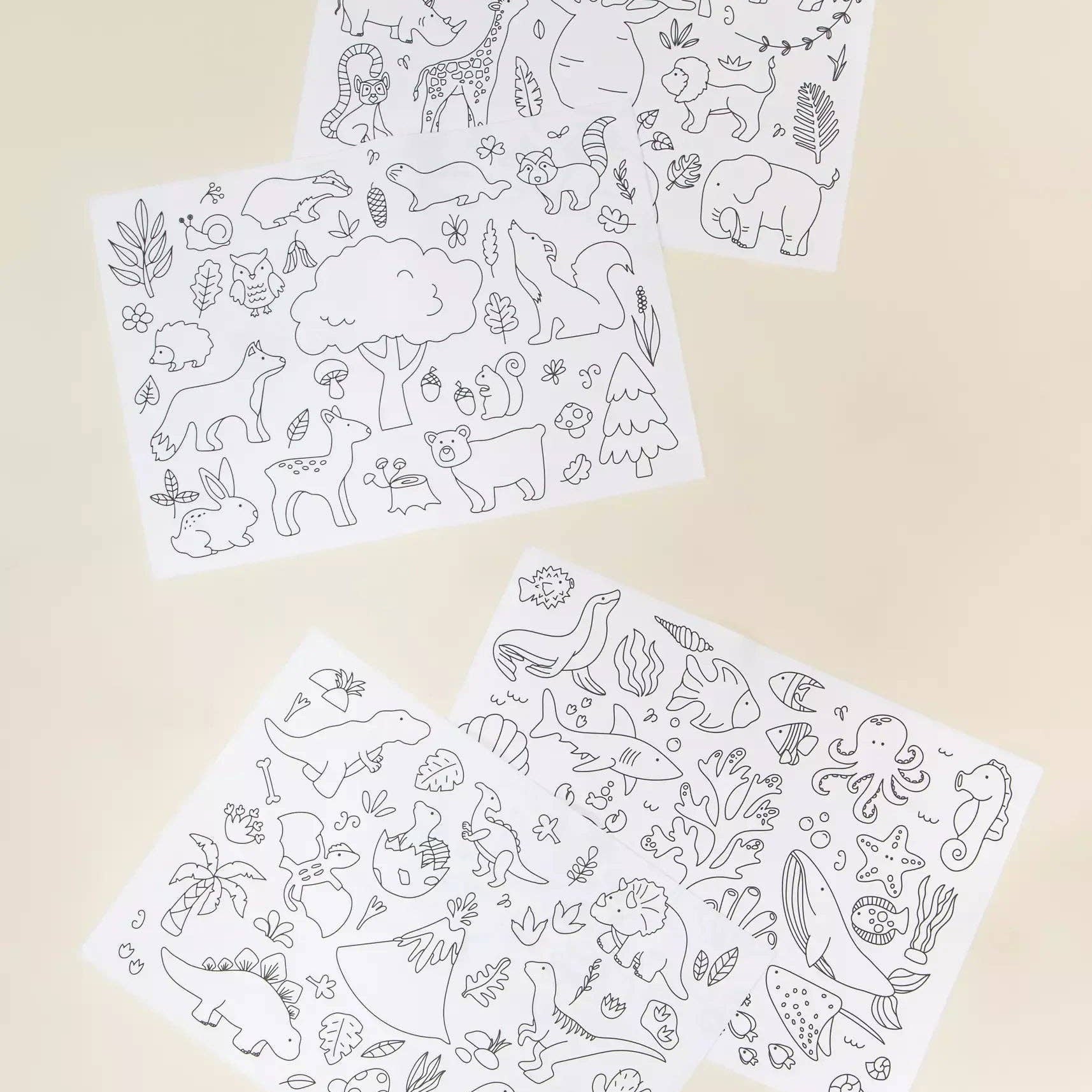 Two sheets of animal-themed coloring pages on a beige background