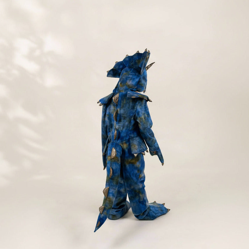 Blue dragon-like creature figure on a white background