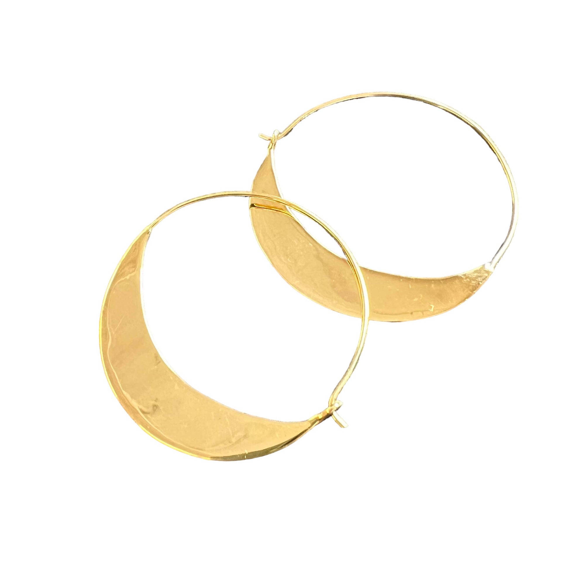 Gold hoop earrings on a white background