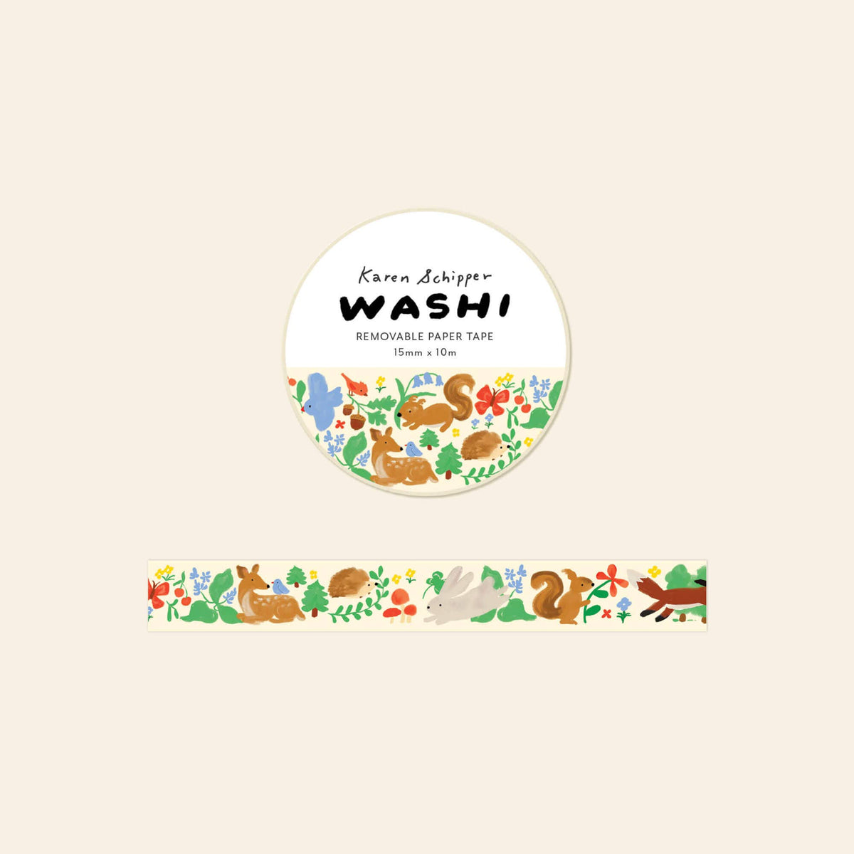 A roll of Karen Schipper WASHI removable paper tape with a woodland animal and nature pattern, shown with the circular label and a strip of the tape below on a light beige background.