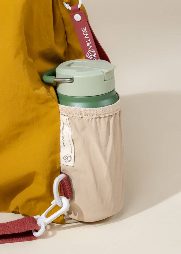 Green water bottle with beige sleeve attached to a yellow backpack