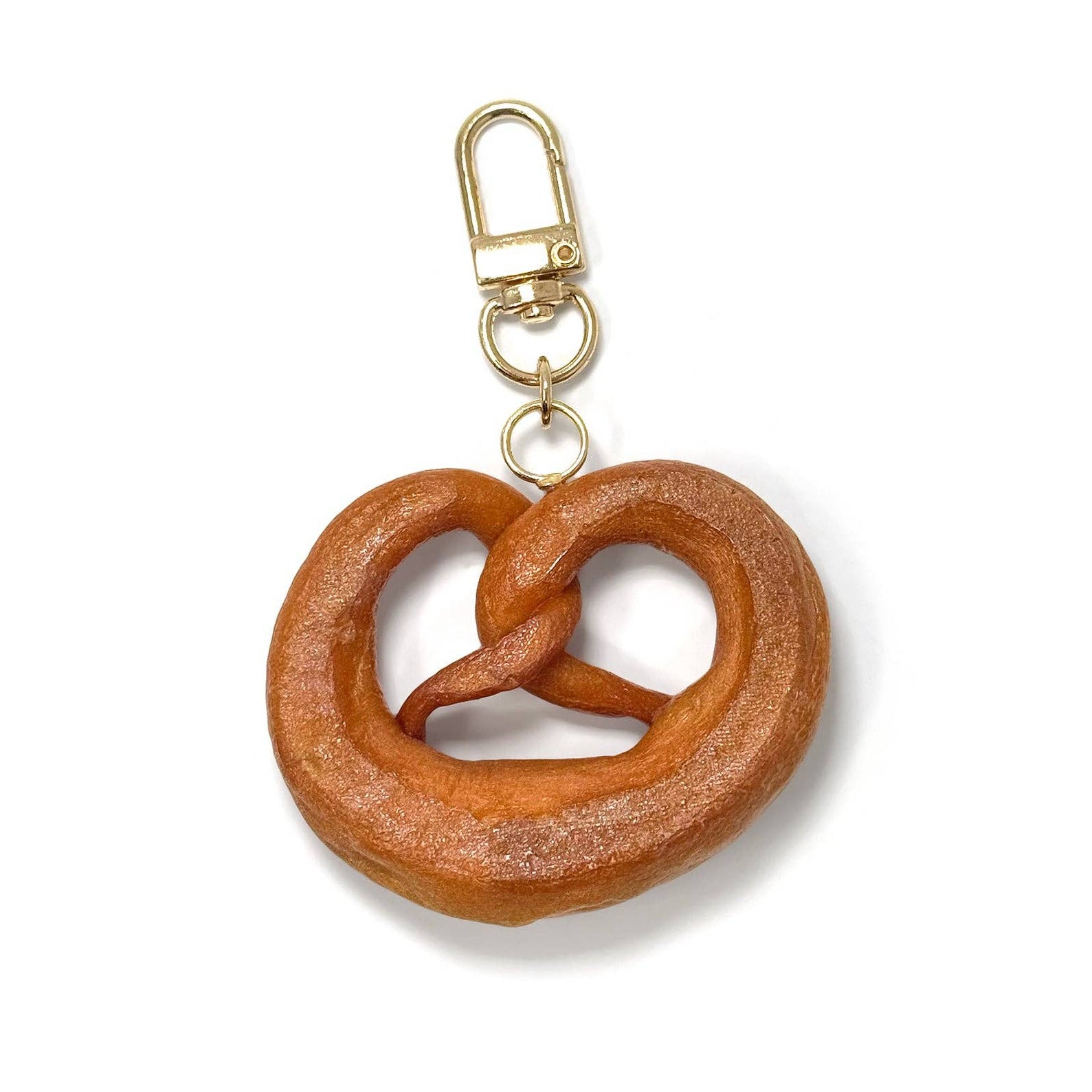 Brown pretzel-shaped keychain on a white background