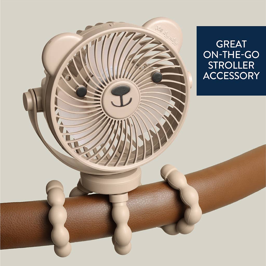Beige fan with bear design attached to a brown handle, on a light gray background.