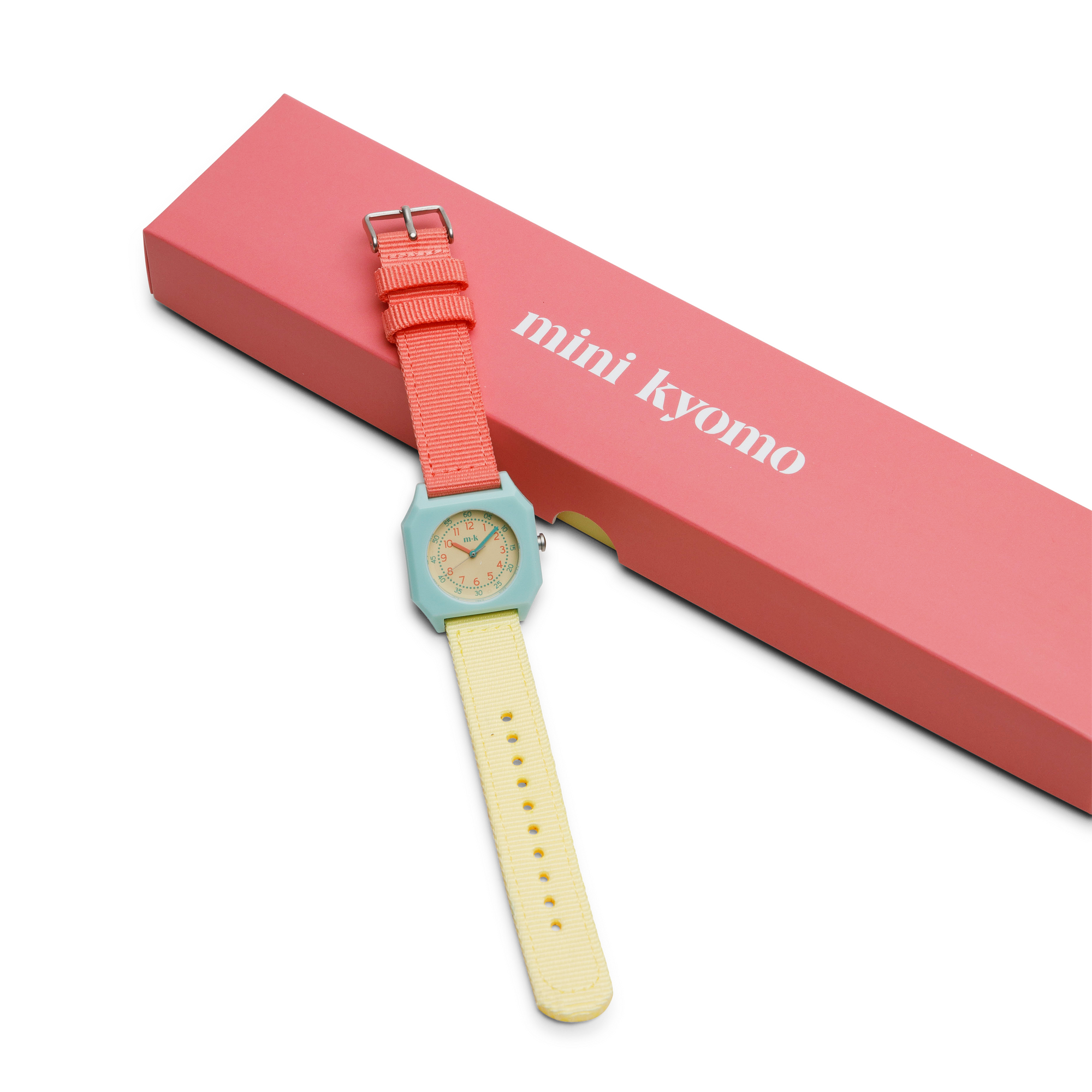 Watch with pink strap and light yellow case on a white background