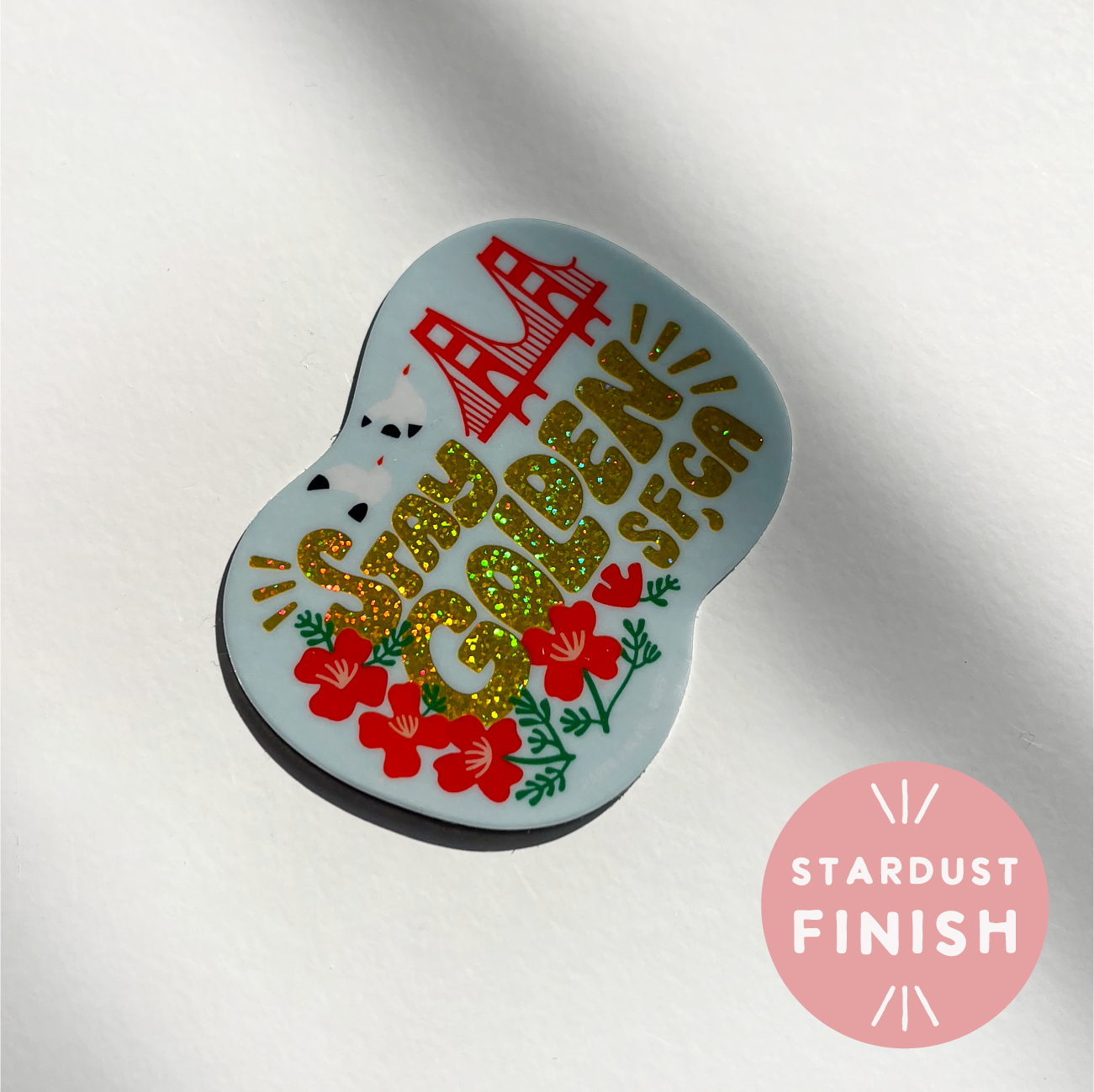 Decorative item with text and floral design on a white background, featuring a 'Stardust Finish' label.