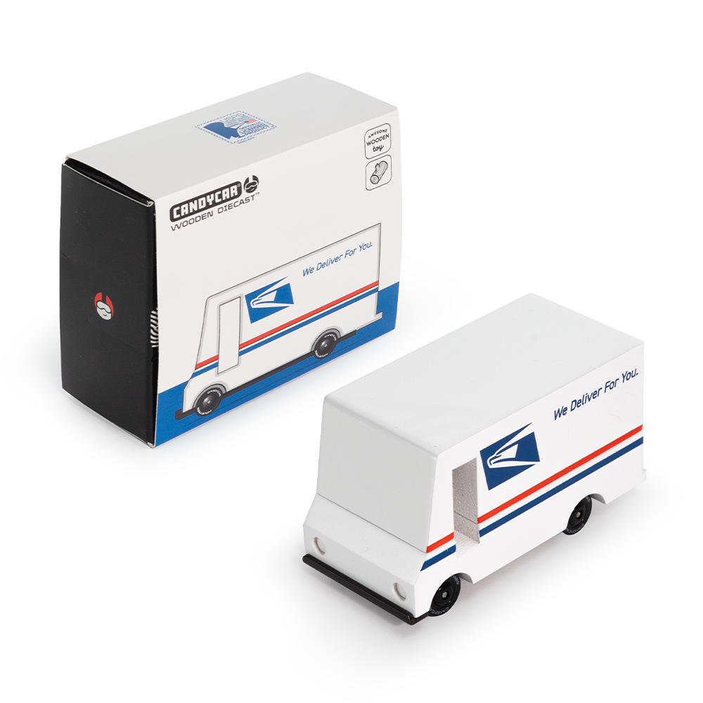 Model of a USPS delivery truck next to its packaging on a white background
