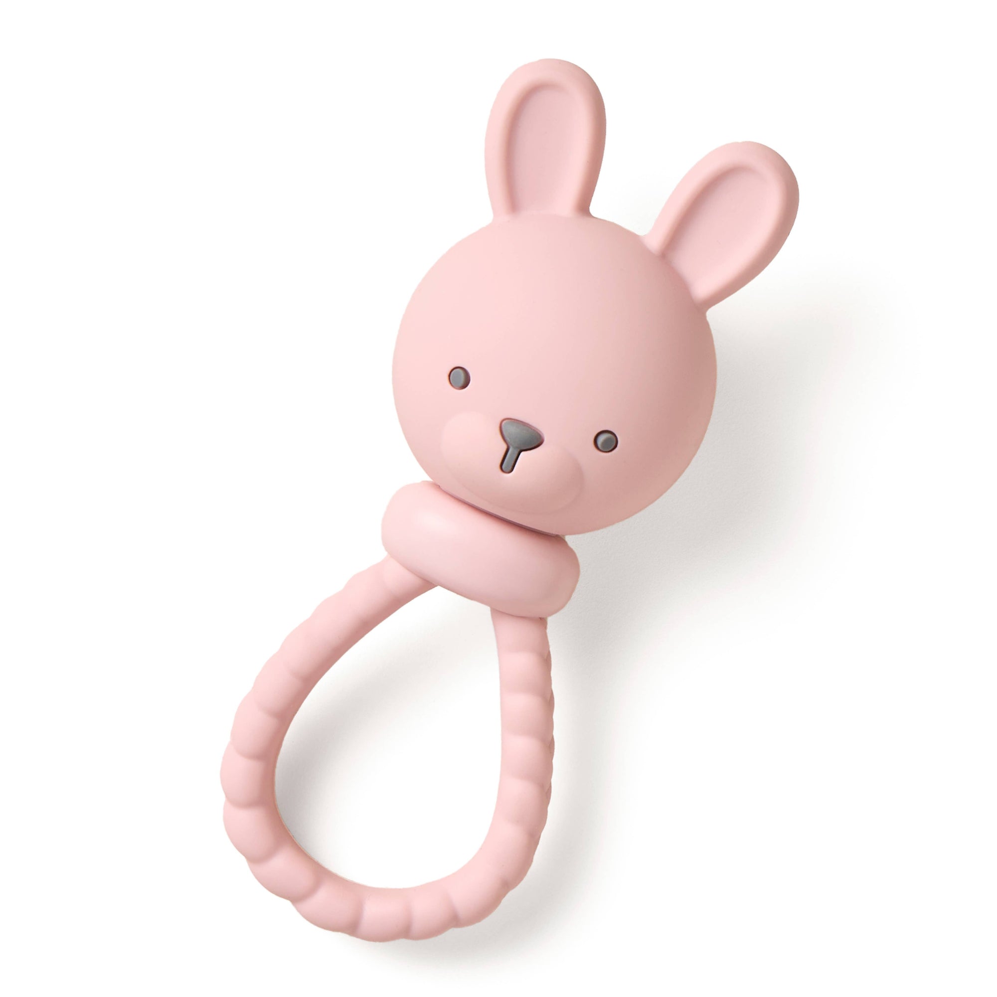 Pink rabbit-shaped teething ring on a white background